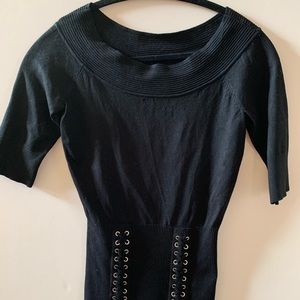 Cache black top with lace up detail in front.